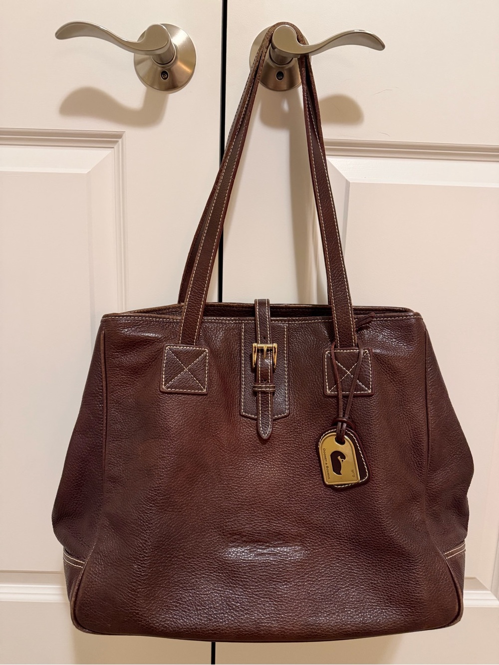 Dooney & Bourke Brown Pebbled Leather Tote with Buckle and Logo Tag